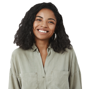 Waist-up shot of cute friendly-looking pleasant African American female friend with curly hairstyle in trendy blouse tilting head smiling joyfully and looking with warm tender expression at camera.