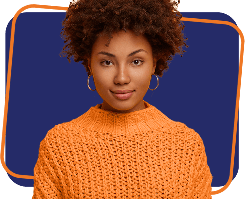 Portrait of Afro American millennial woman with calm serious face expression, looks directly at camera, wears knitted jumper, has natural beauty