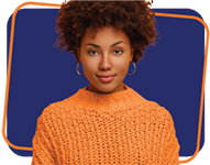 Portrait of Afro American millennial woman with calm serious face expression, looks directly at camera, wears knitted jumper, has natural beauty