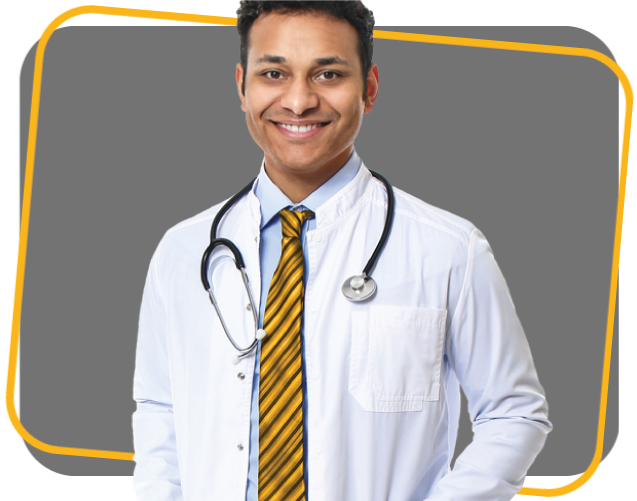 Smiling male doctor wearing a lab coat and a yellow tie with a stethoscope around his neck.